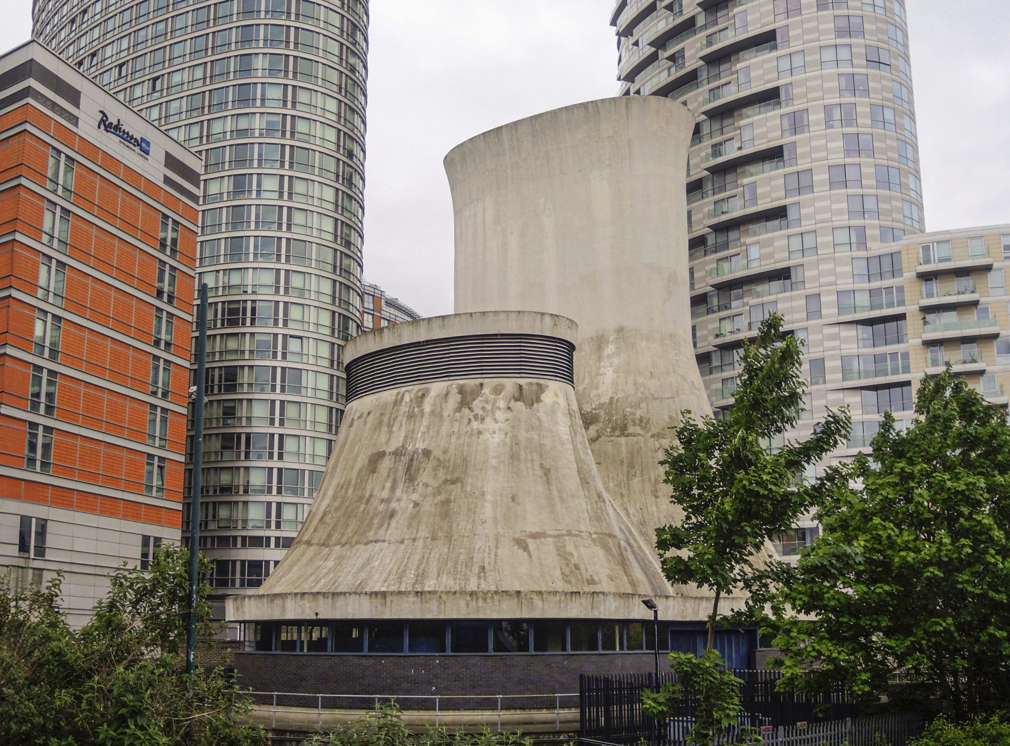 A shaft surrounded by tall buildings